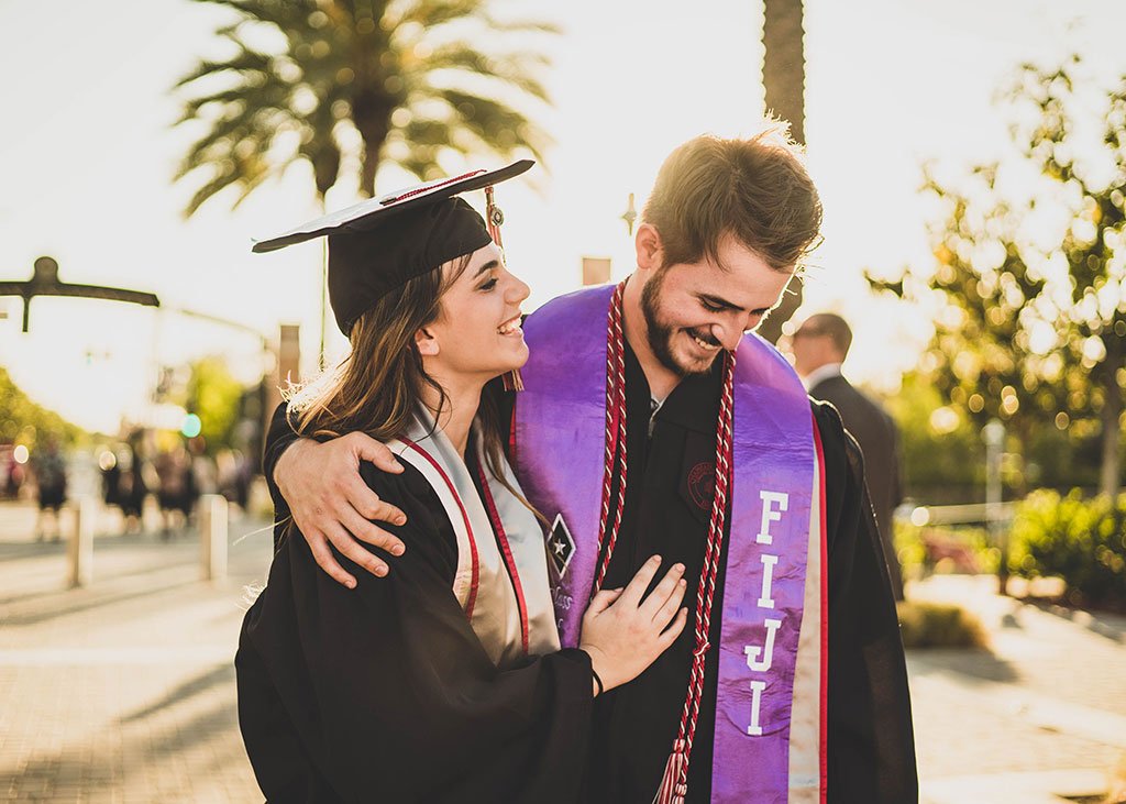 Graduating college students celebrating success